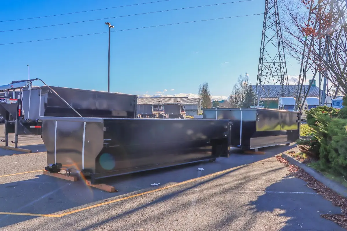 Roll-off dumpster ready for waste disposal at job site for 2 Yard Dumpster Rental in Dakota Dunes